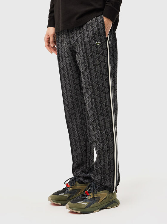 Sports trousers with monogram print - 1