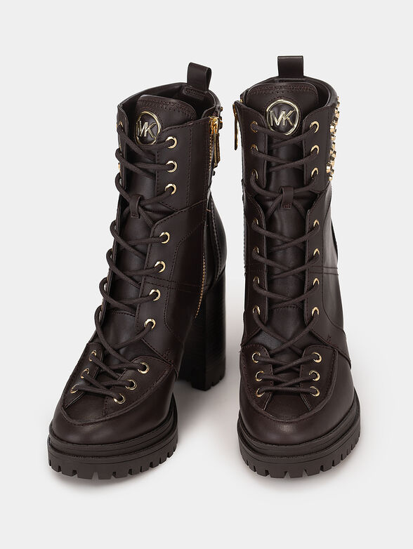 Leather boots accented with appliqued eyelets - 6