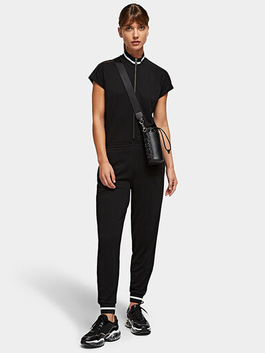 Black jumpsuit with branded tapes - 5