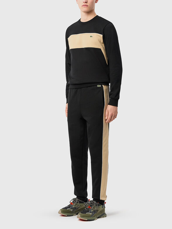 Black sports trousers with contrasting trims - 1