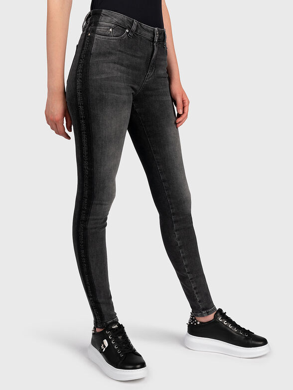 Skinny jeans with branded straps - 1