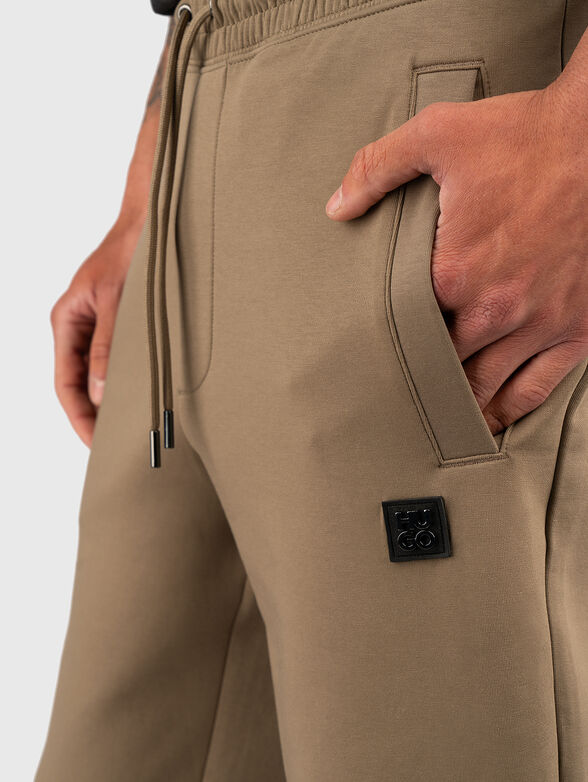 Cotton trousers with ties and logo detail - 3