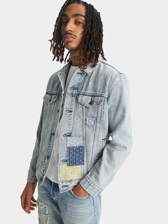 THE TRUCKER™ denim jacket with patchwork accents - 1