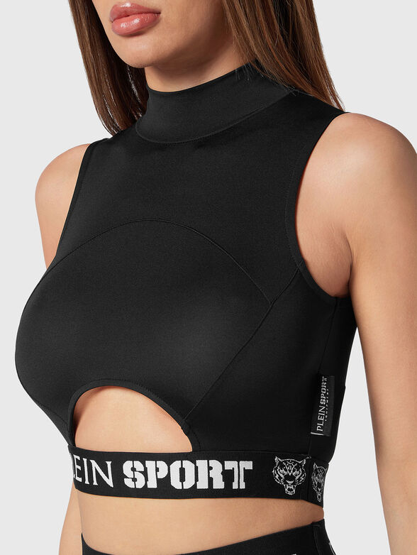 Sports top in black with cut out accent  - 4