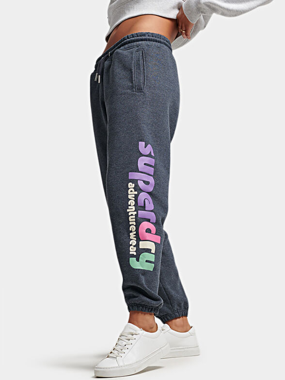 Blue sports pants with colorful logo print - 3