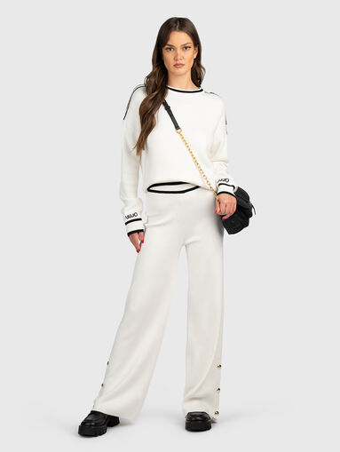 Pants with buttons on the legs - 5