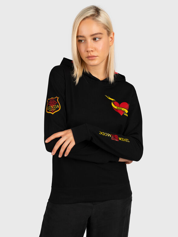 Sweatshirt with hood and art details - 1