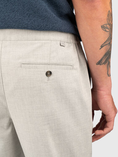Trousers with waist  ties and pockets - 3