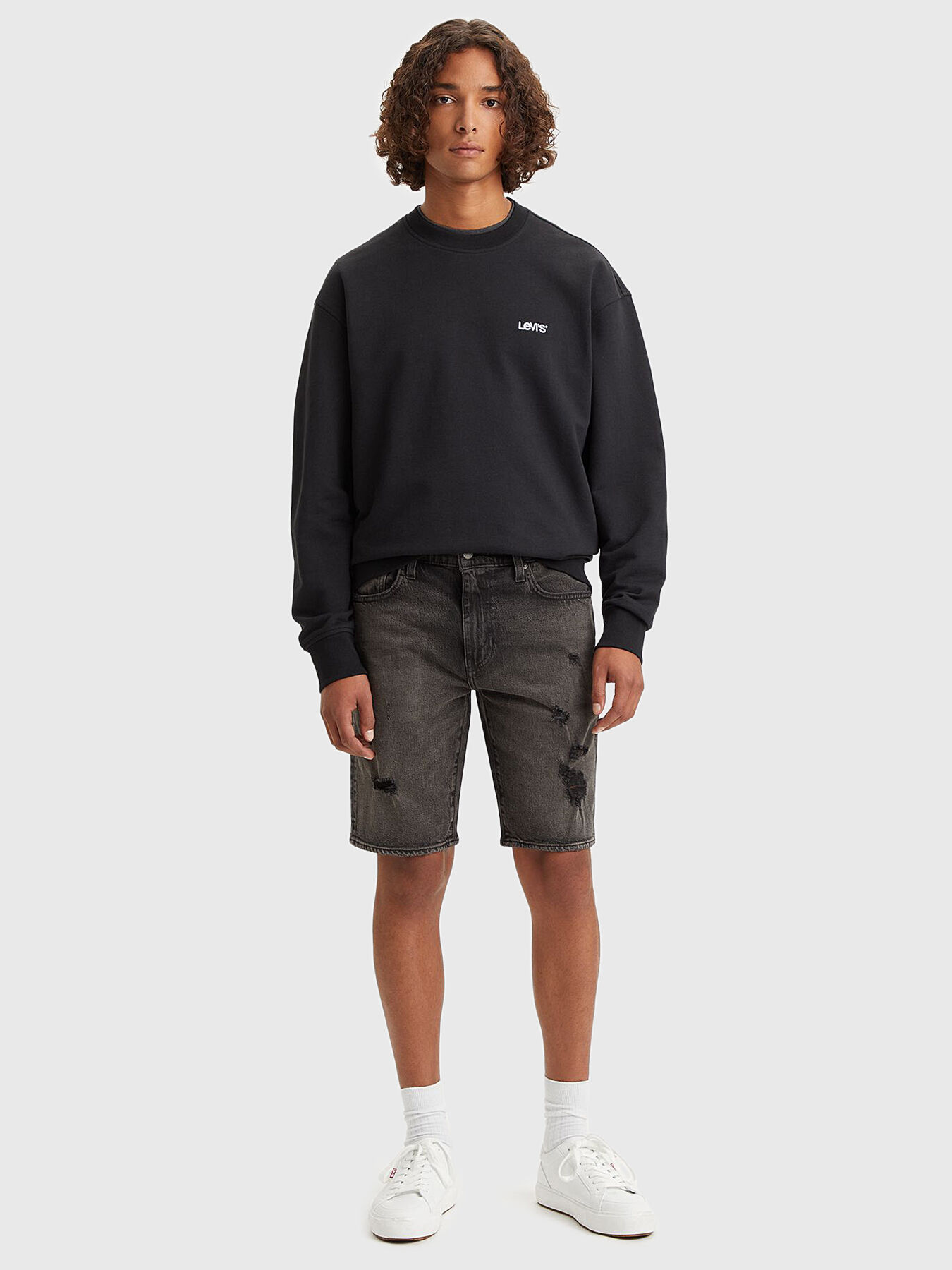 Black ripped levi shorts hot sale