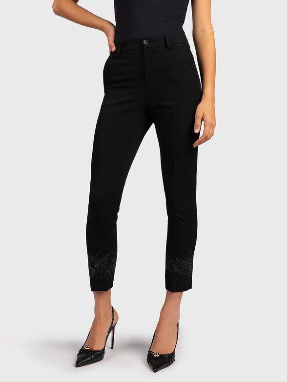 Black pants with appliqued rhinestones - 1