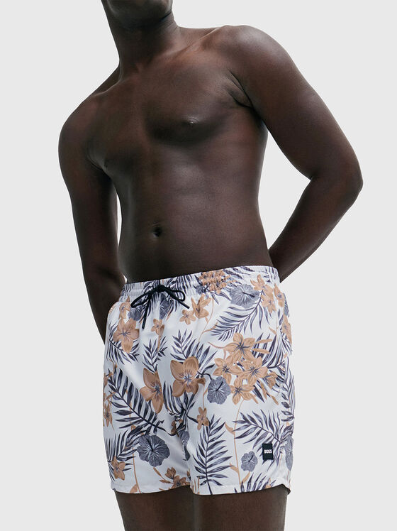 Beach shorts with floral motifs - 1