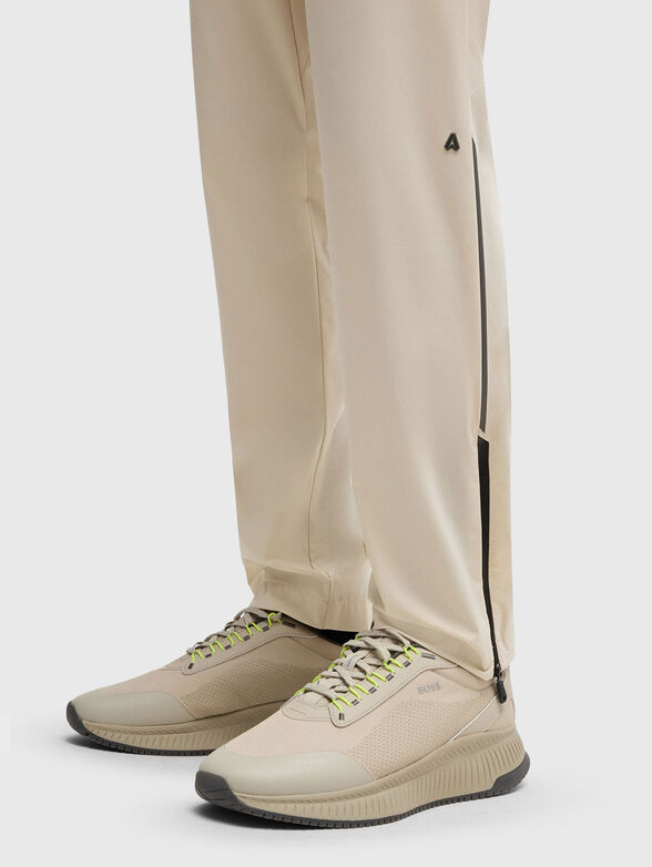 Sport trousers with an accent zip and logo - 3