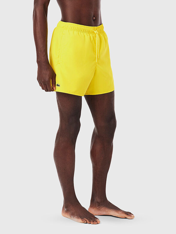 Yellow shorts with logo detail - 1