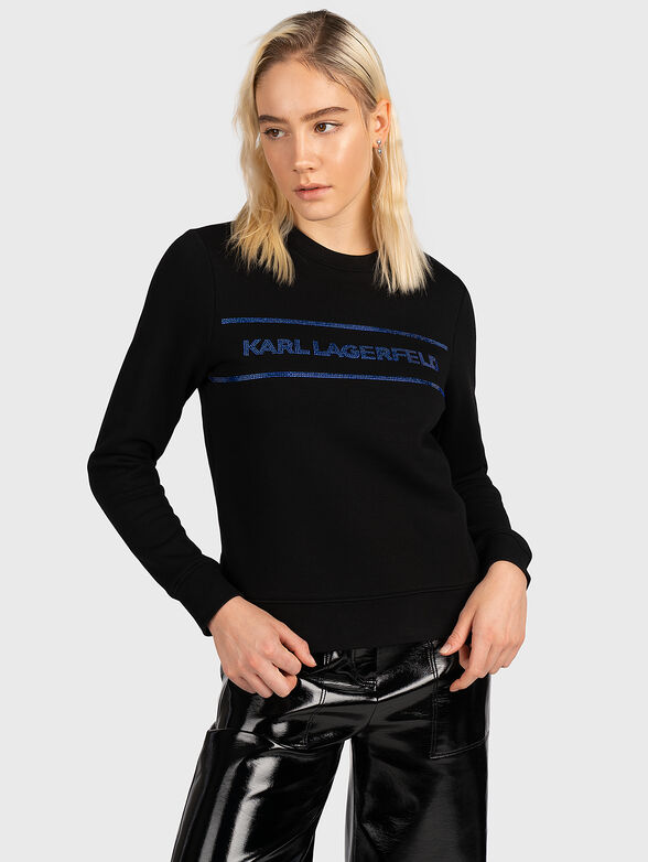 Sweatshirt with logo accent from applied rhinestones - 1