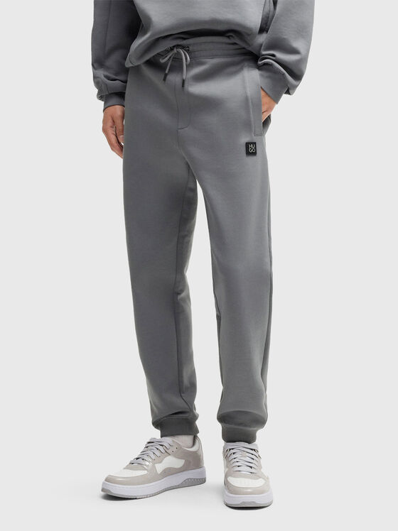 Cotton trousers with ties and logo detail - 1