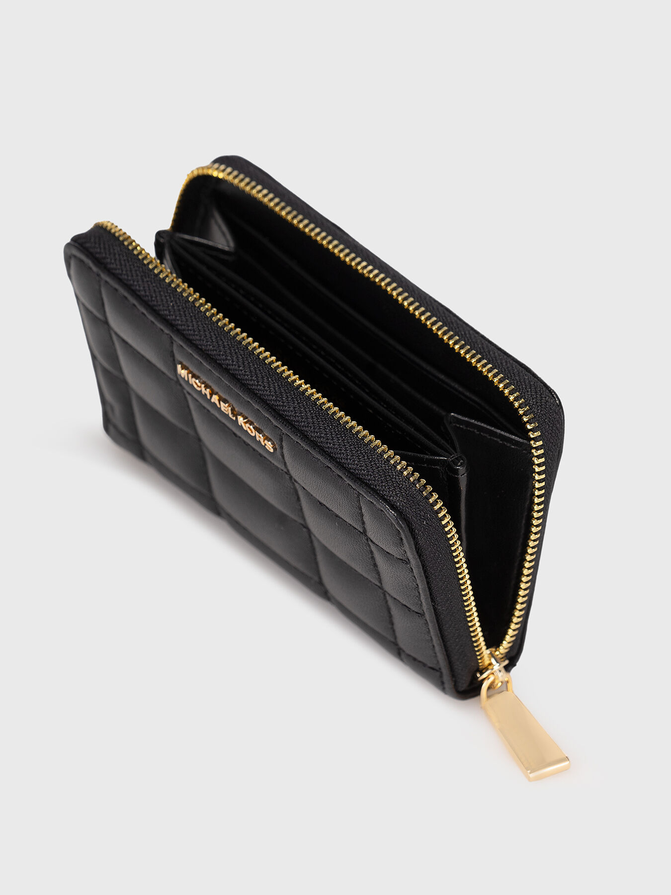 Black leather wallet with quilted effect brand MICHAEL KORS Globalbrandsstore en
