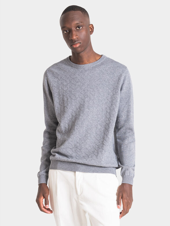 Blue sweater with art details - 1