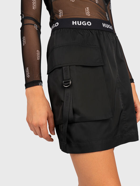 Skirt with cargo pockets and logo accent - 3