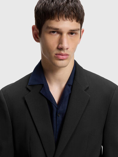 Slim-fit suit jacket with metal buckle closure - 4