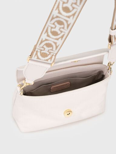Leather bag with accent strap - 5