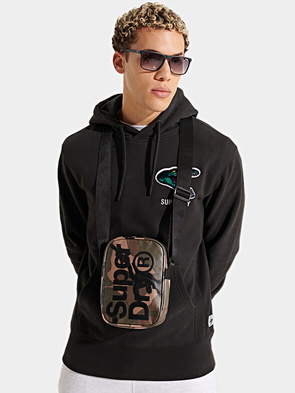 Crossbody bag with embossed logo accent - 6