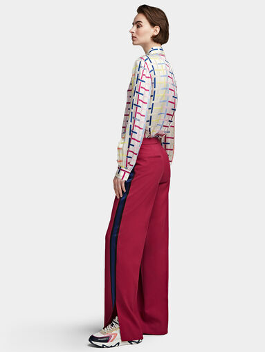 Trousers with flared legs with slits - 3