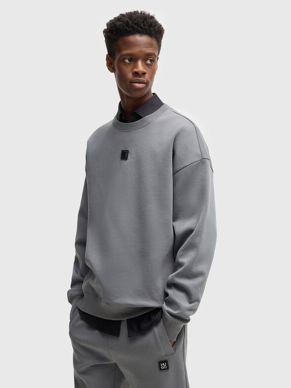 Sweatshirt with oval neckline in black - 1