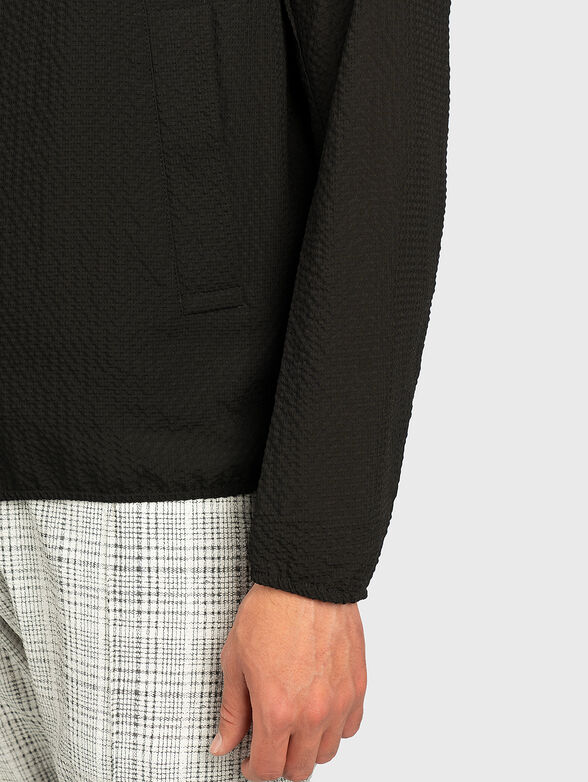 Jacket with an asymmetrical fastening - 3