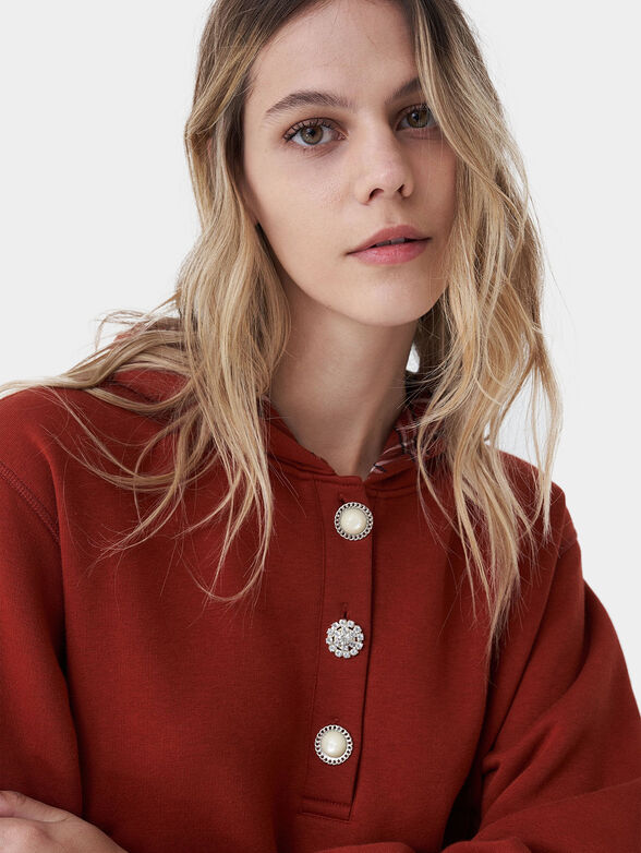 Hooded sweatshirt and accent buttons - 4