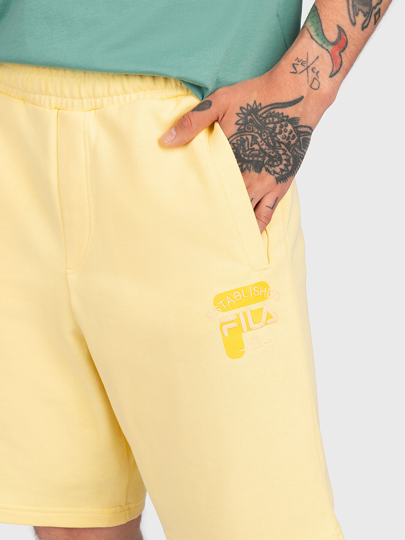 Fila shorts gold best sale