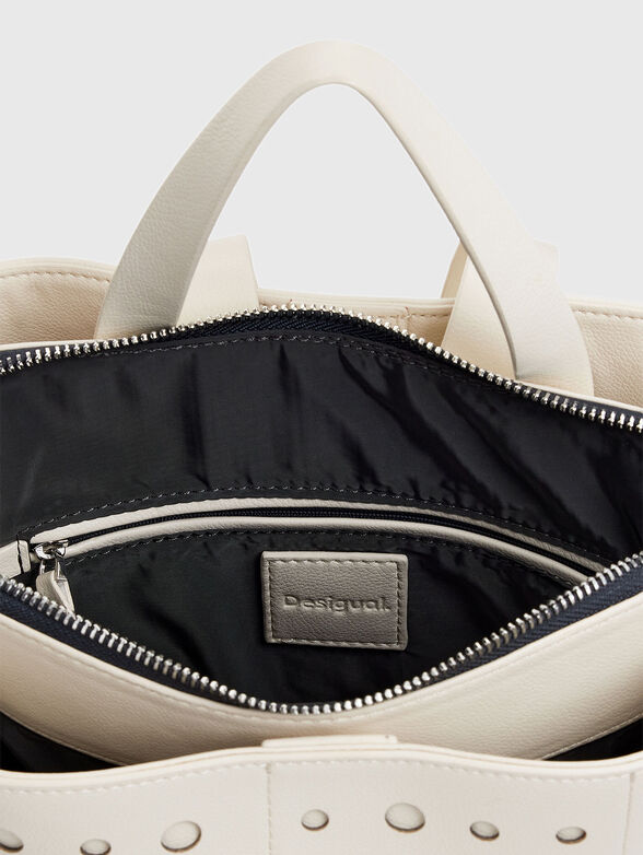 Backpack with perforations in black - 6