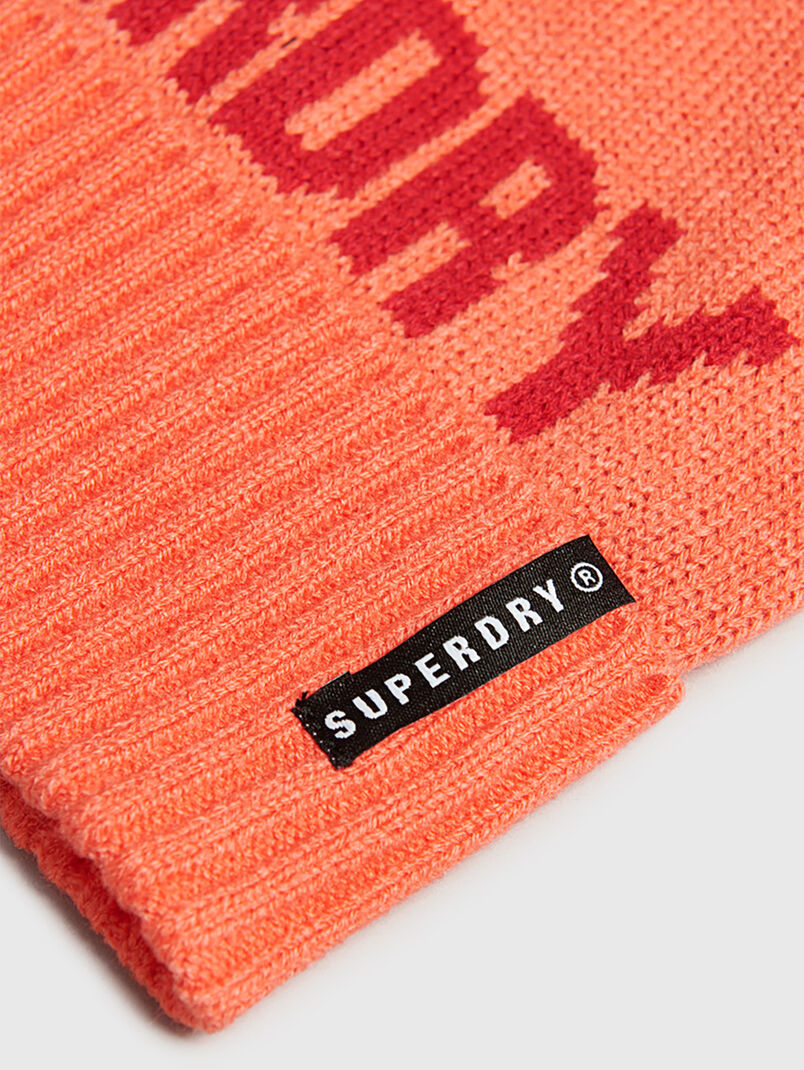 Knitted hat in coral color - 3