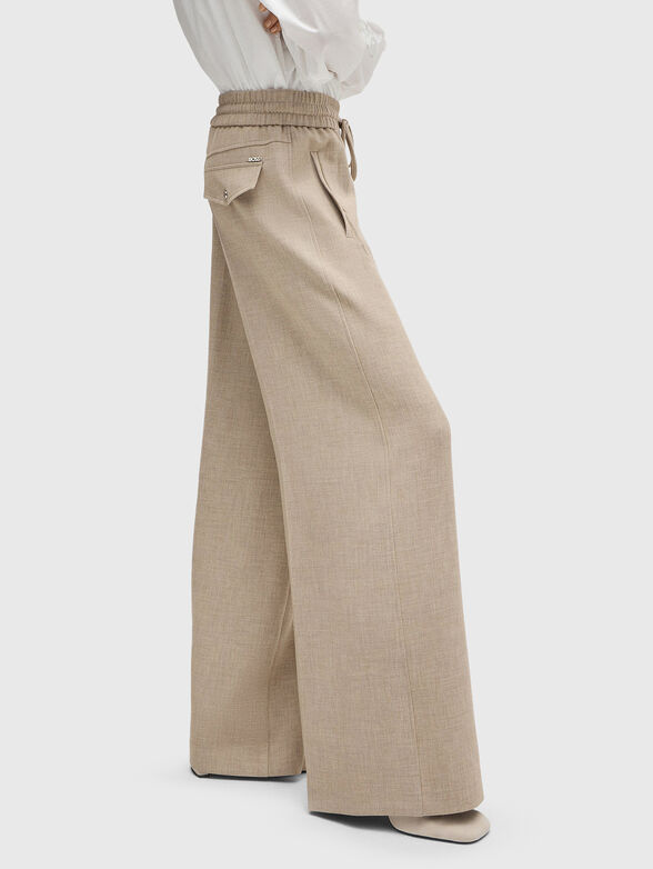 Beige trousers ties at the waist - 3