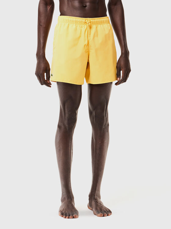 Yellow shorts with logo detail - 1