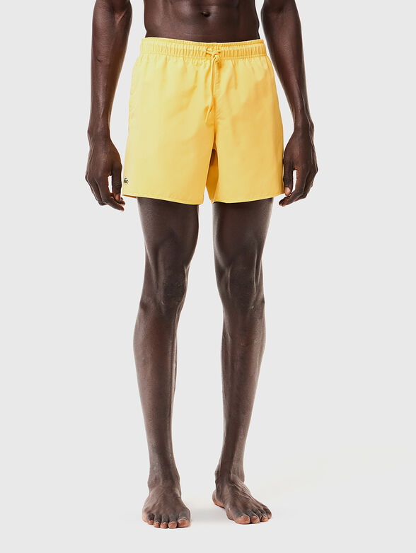Yellow shorts with logo detail - 1