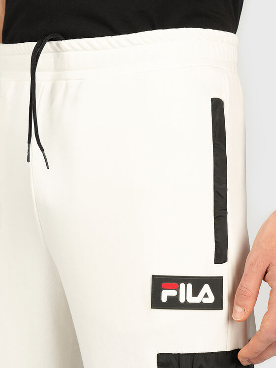 Sports pants with contrasting pocket - 1