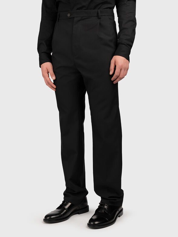 Straight cut trousers in black colour - 1