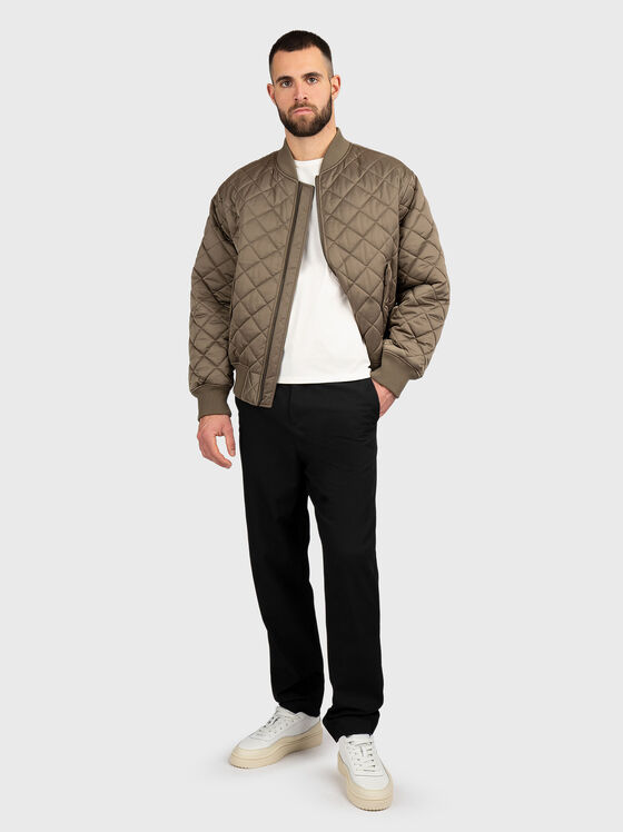 Quilted jacket with side pockets - 1