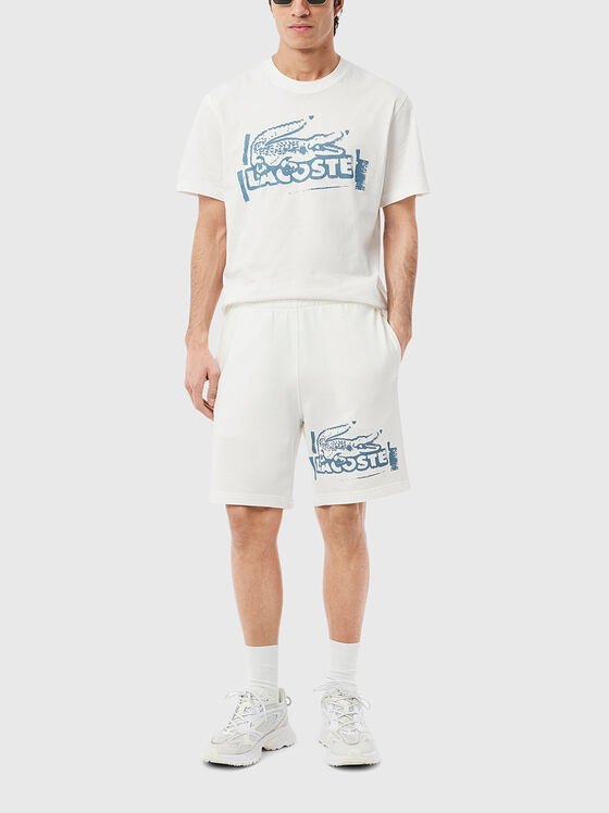 Cotton shorts with logo print in ecru - 1