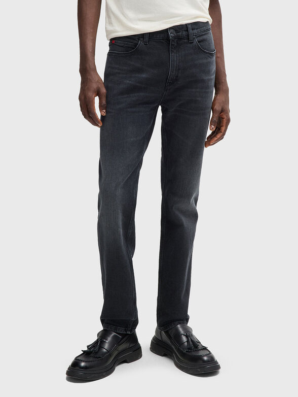 Jeans with washed effect and logo - 1