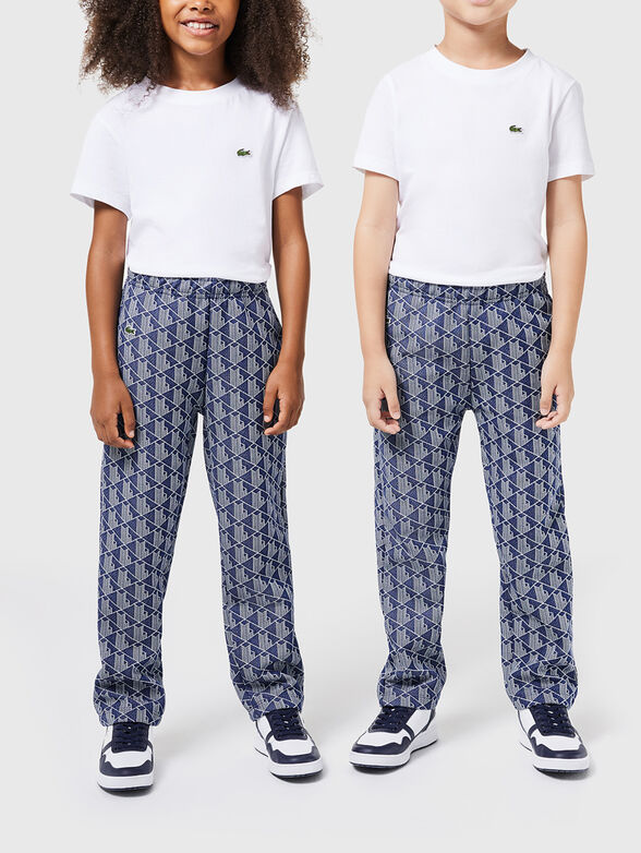 Black sports trousers with geometric pattern - 1