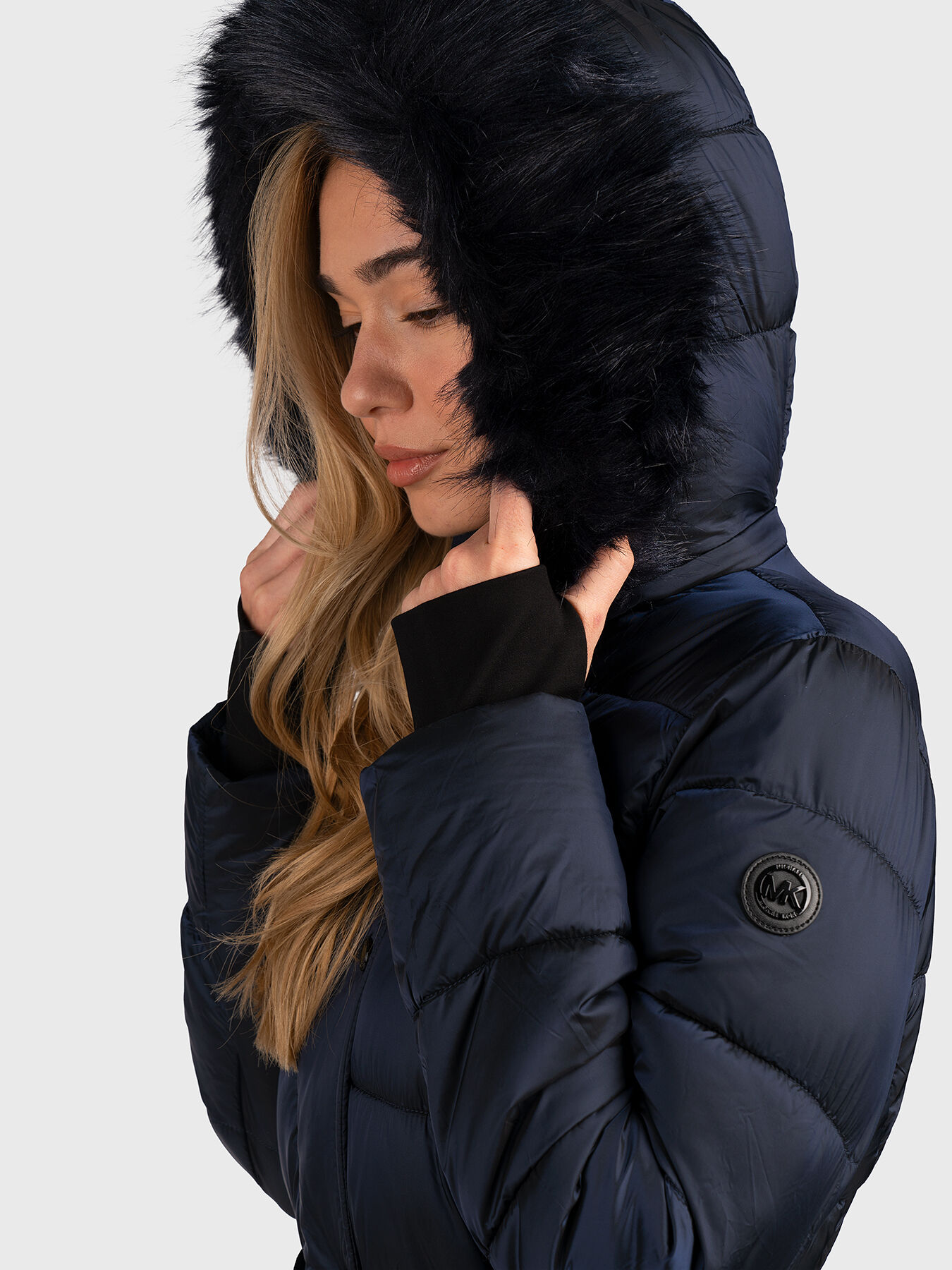 Hooded long jacket in dark blue color with belt brand