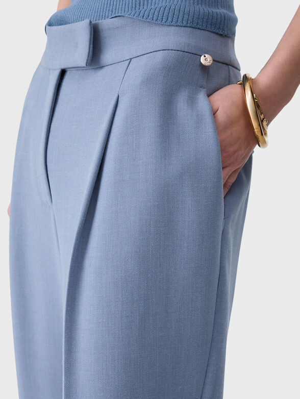 Blue trousers made of melange fabric - 3