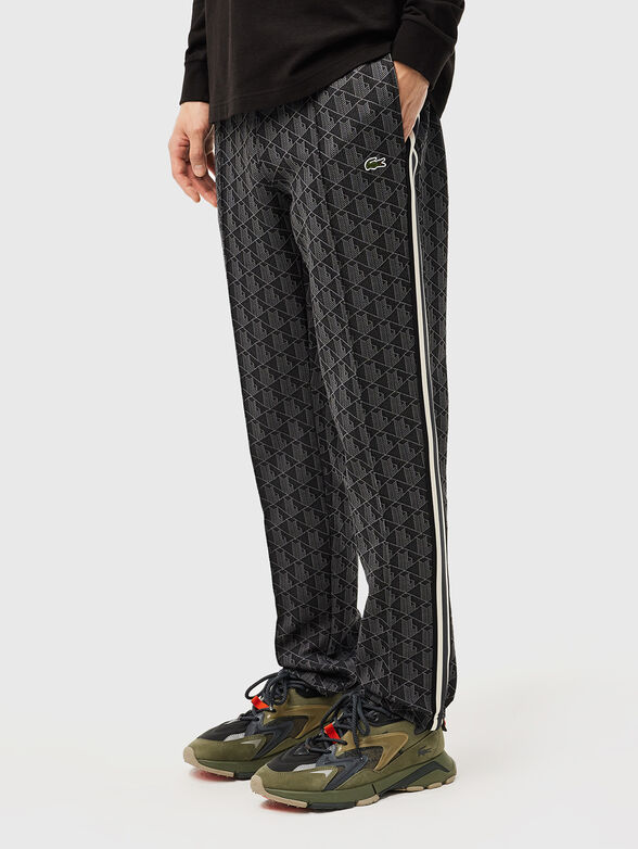 Brown sports trouser with monogram print - 1