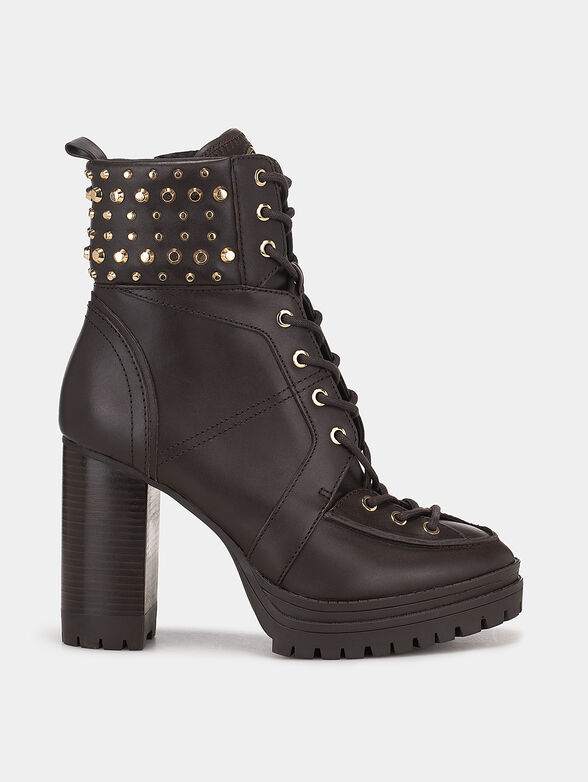 Leather boots accented with appliqued eyelets - 1