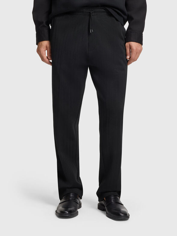 Trousers with elastic waist and logo patch - 1