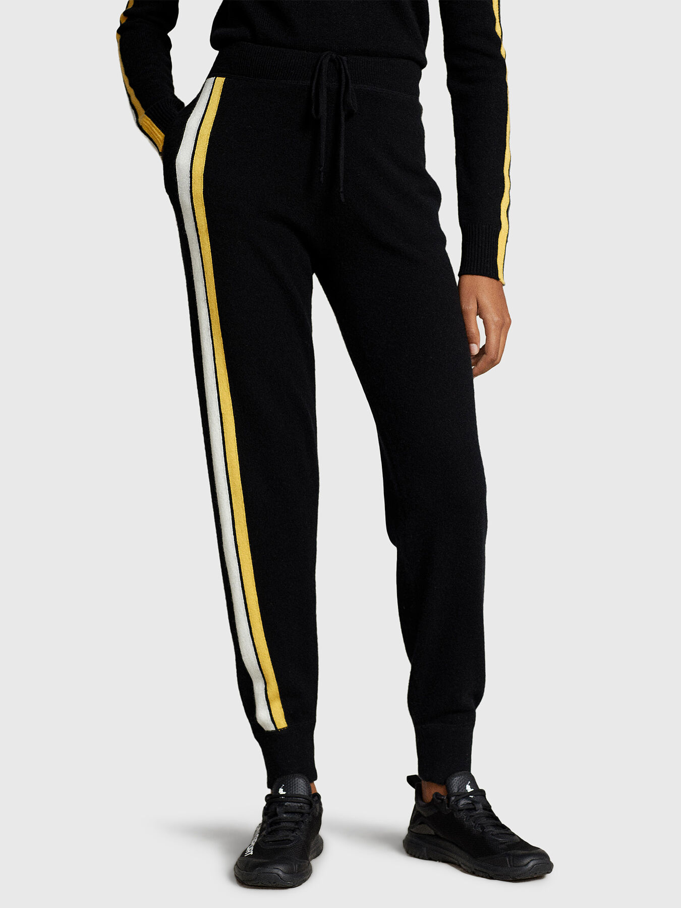 Black joggers with yellow stripe sales