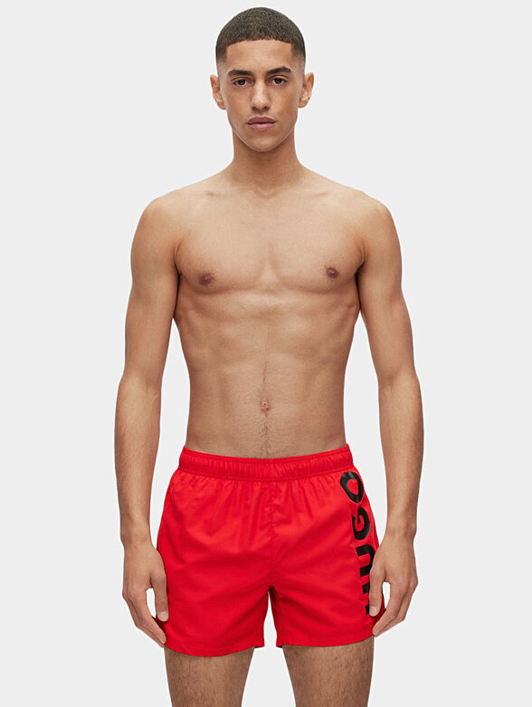 Black beach shorts with logo detail - 1