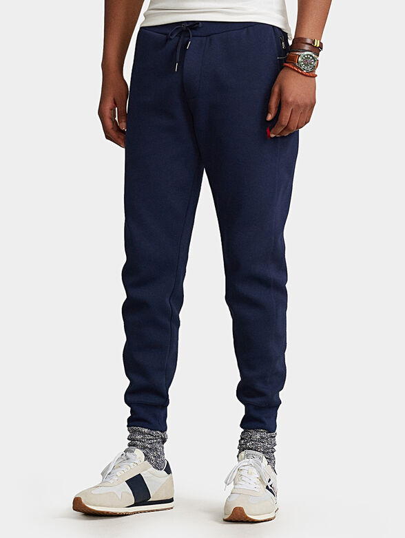 Blue sports pants with logo embroidery - 1