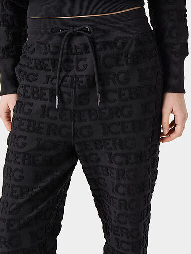 Pants with embossed logo texture - 4